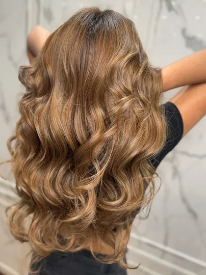 Another angle of this stunning blonde balayage, showing its shine and dimension.