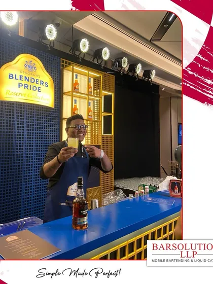 A toast to a successful evening. Our bartender presents a finished cocktail at the stylish Blender's Pride bar.