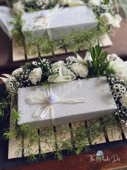 Quiet elegance is my signature. These made-to-order boxes, nestled in fresh white carnations and greenery, were crafted for a corporate thank you gift. They show how even bulk orders can feel deeply personal and sophisticated.
