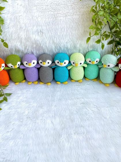 A rainbow of penguin babies! I made this colorful flock as return gifts for a birthday party. Each penguin is a different color, making them a unique and memorable party favor.