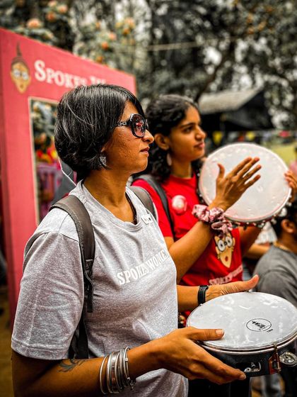Getting into the rhythm at the Garage Sale. Our members look great in their community tees while participating in the event's activities.