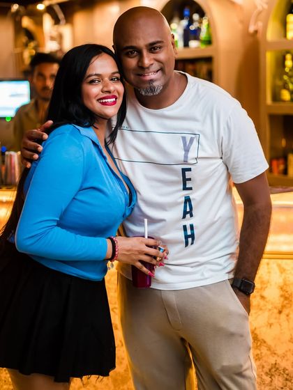 Posing with a guest during an IPL screening night. I often incorporate live sports screenings into my events, adding another layer of excitement.