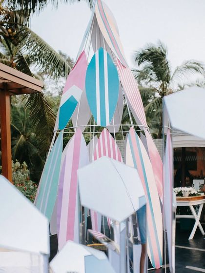 For a beach destination wedding, we created this cool installation using surfboards in subtle pastel hues. It served as a fun photo booth and an interesting visual experience that perfectly matched the vibe.