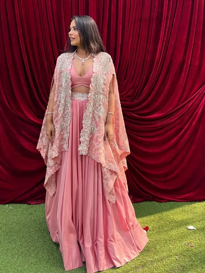 A picture-perfect day in a picture-perfect outfit. I loved wearing this pink skirt and crop top with an embroidered cape for a day wedding.