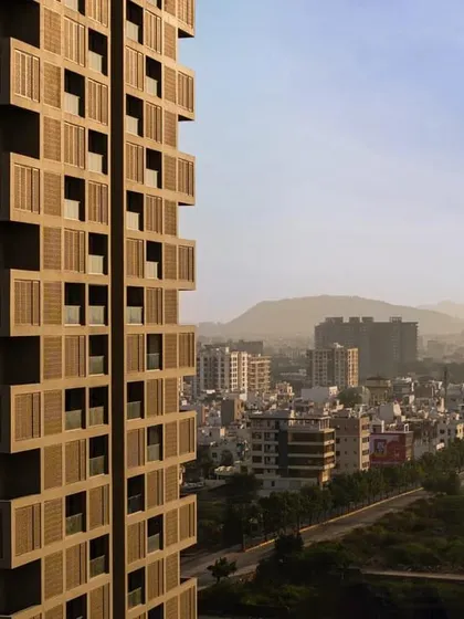 The residential tower stands tall against the Udaipur skyline, its unique facade creating a new landmark for the city.