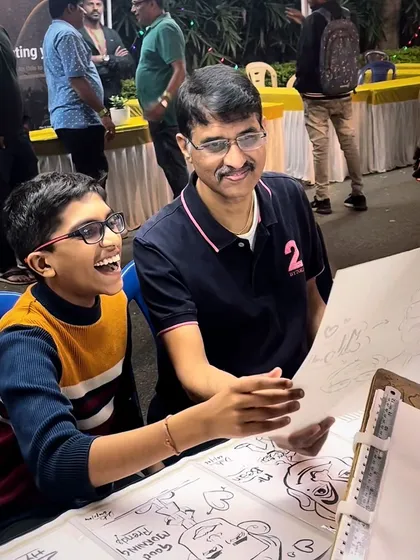 This is what it's all about. That moment of pure joy when someone sees their caricature for the first time is why I love my work. This father and son's reaction at a live event was priceless.