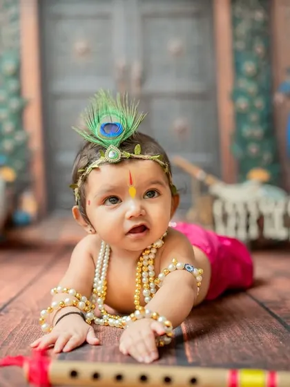 A sweet tummy-time pose, capturing the baby's strength and curiosity.