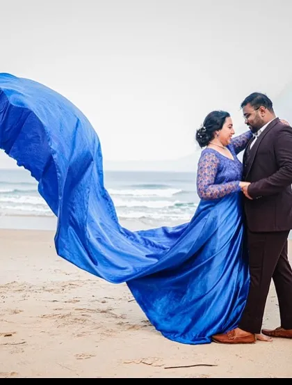The ocean breeze brings this royal blue gown to life. The long, flowing train is my specialty, designed to catch the wind for dramatic, sweeping shots during your beach pre-wedding session.