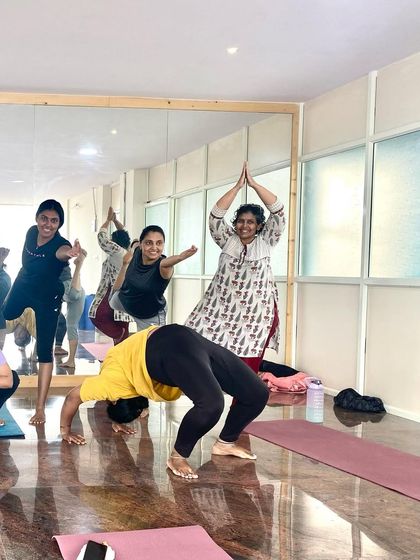 A fun, candid moment in the studio. Yoga is a serious practice, but we always make room for joy, laughter, and celebrating each other's progress.