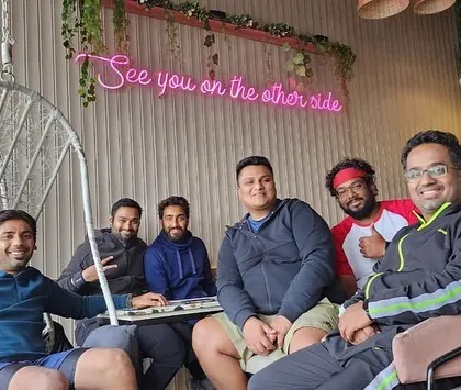 "See you on the other side." A fun group photo from a cafe outing with our players. Building a strong community is just as important to us as building strong tennis players.