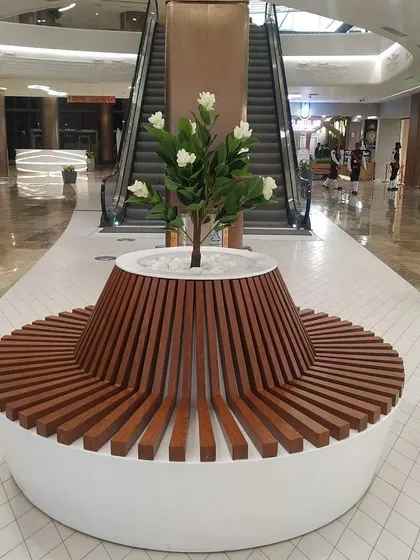 I love creating functional art, like this custom circular bench with an integrated planter at Lulu Hypermarket. It provides seating for shoppers while seamlessly incorporating a beautiful artificial flowering tree, making it a natural centerpiece for the corridor.