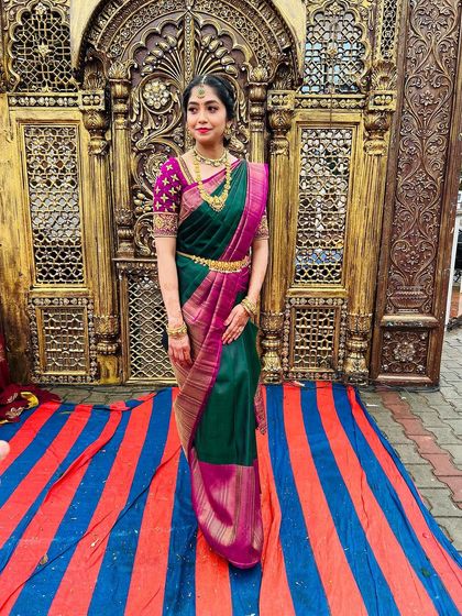 The rich colors of her saree are beautifully complemented by the warm, glowing makeup look.