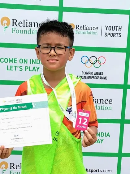 One of our U11 players proudly holding his Player of the Match certificate from the Reliance Foundation Junior League.