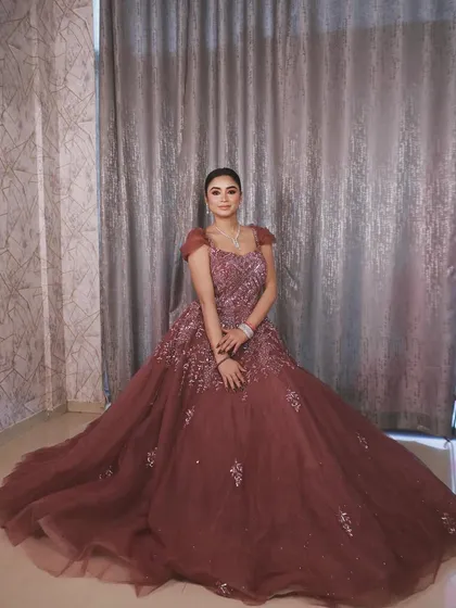 Another beautiful seated photo showing the sheer volume and drama of this gorgeous rental gown.