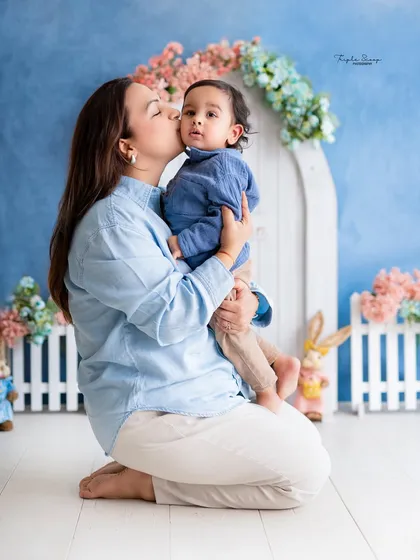 A mother's kiss for her son. This photo, taken during a themed Easter shoot, is a perfect example of a tender mother-son moment.