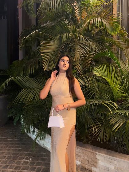 A full-length shot of the beige gown, perfect for a formal event.