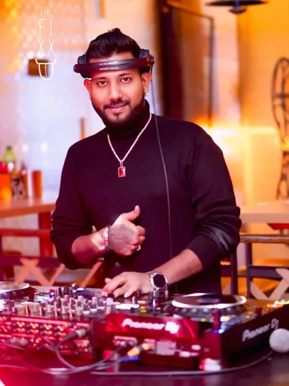 A close-up shot in a black turtleneck, ready for a stylish night of music at The Fixx.