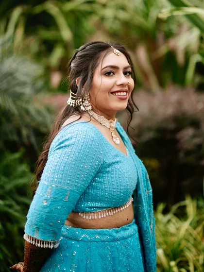 A happy bride enjoying her pre-wedding festivities. Her natural, glowing makeup look is fresh and vibrant.