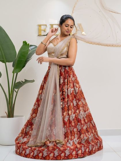 Bloom in elegance with this tulip flower georgette printed lehenga. I paired the floral skirt with a stunning thunder grey raw silk blouse, fully embroidered with gold zardozi for a perfect festive look.