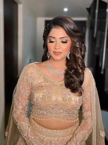 A close-up of Krisha's sangeet makeup, showcasing the warm tones and shimmer on her eyes.