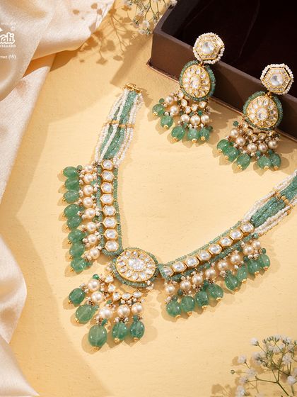 The Tourmaline Trail necklace, a gentle river of pastel green gemstones and soft pearls. This piece is for the woman who appreciates understated luxury and a poetic blend of color and craft.