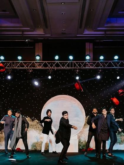 The groomsmen raising the bar with a coordinated and powerful sangeet performance.