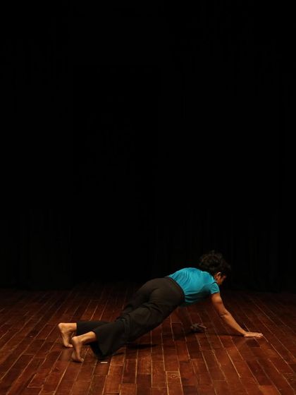 A dancer moves across the floor during a tech run.