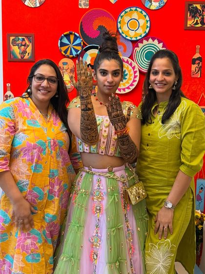 A proud moment with a happy bride and my partner Pinky. We love being a part of our clients' special days.