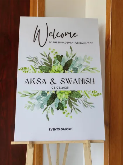 A clean and elegant welcome sign for Aksa and Swanish's engagement ceremony, featuring a beautiful watercolour greenery design.