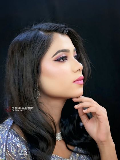 Sleek, simple, and chic. This look proves that sometimes less is more, with straight, healthy hair and sharp makeup creating a polished and modern party vibe.