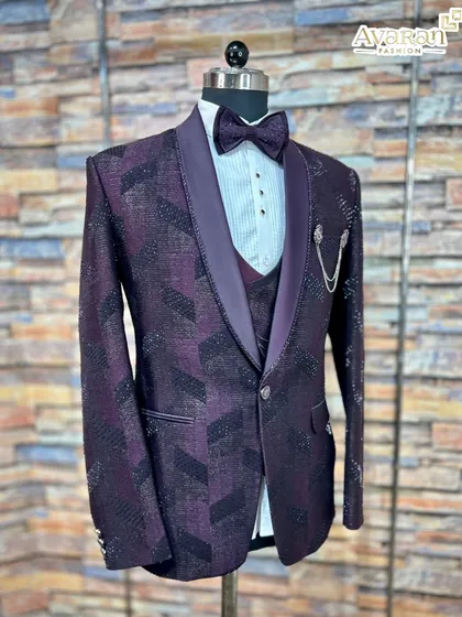 Make a statement in this wine-colored five-piece reception suit. The jacket's textured geometric pattern and shimmer, paired with a matching waistcoat and bow tie, create a polished and celebratory outfit ready for any grand event.
