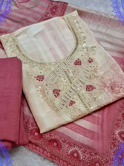 An elegant unstitched dress material in shades of pink and cream. The top features delicate sequin work around the neckline, and the dupatta has a beautiful digital print, making it perfect for parties.