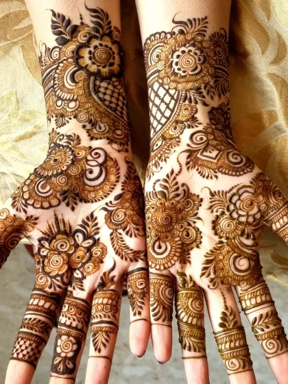 A beautiful example of guest mehndi that still feels full and festive. This Indo-Arabic design combines floral patterns on the palm with checkerboard fills and detailed finger work.