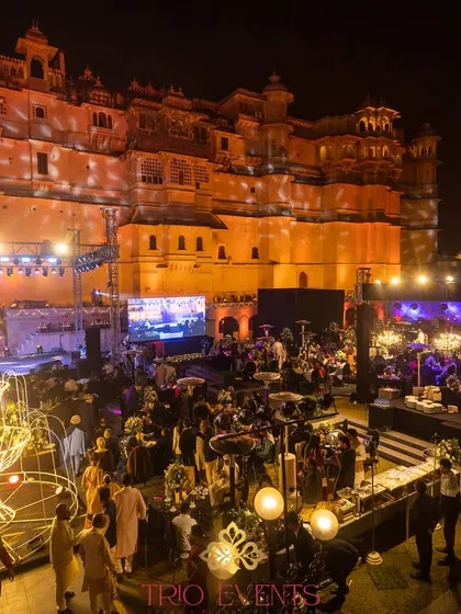 The view of the Sangeet celebration with the majestic City Palace Udaipur as the backdrop. My planning ensures that the venue itself becomes the most spectacular element of your event's decor.