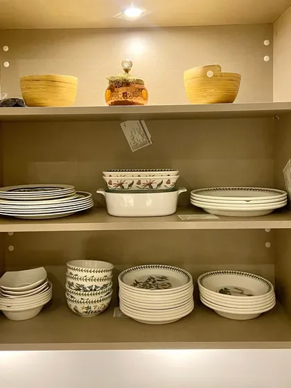 A minimalist crockery cabinet with thoughtfully placed bowls and plates. Sometimes, less is more, and good organization is about creating a sense of space and calm.