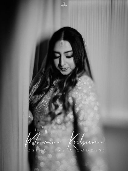 A black and white portrait of a Muslim bride, capturing her serene and graceful presence.