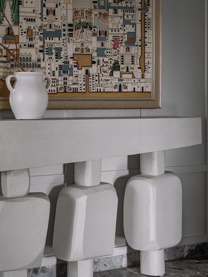 A detail shot from Frenchie Haus showing one of our custom console tables. The sculptural, geometric legs are a signature of our object design, turning a functional piece into a work of art.