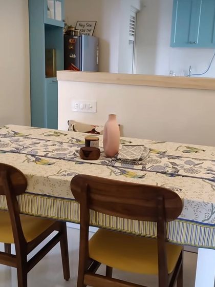 Different shots from our Lotus Boulevard project, where we opened up the kitchen to the dining area. The French-style blue kitchen, dining nook, and colorful decor create a vibrant and interactive living space.