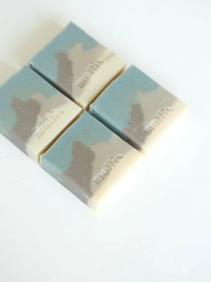 Four 'Rain Veil' bars arranged in a grid, showing their subtle, earthy tones.