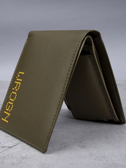 A standing shot of the olive green 'WROGN' wallet.