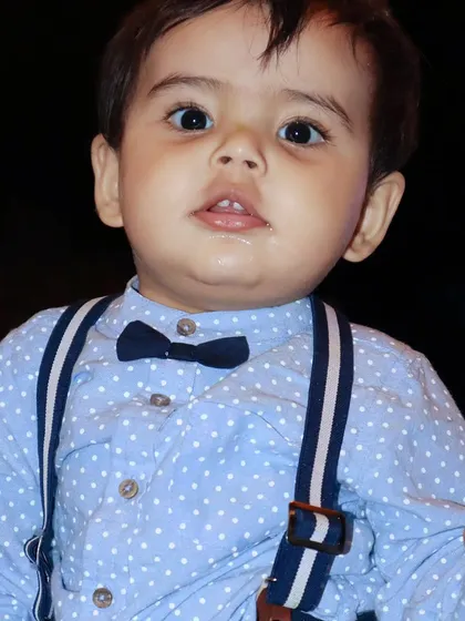 A sweet portrait of my nephew dressed up in a bow tie and suspenders for his birthday. Even in a party setting, I look for those quiet moments to capture a child's personality.