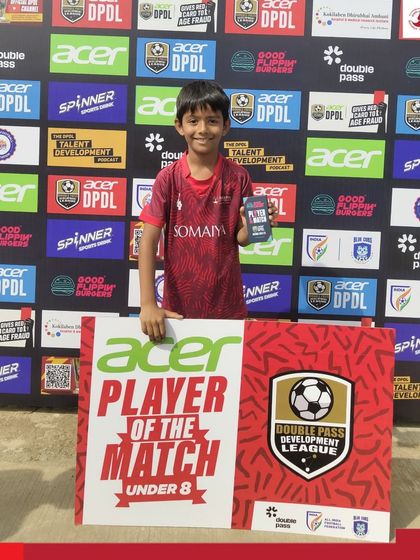 Madhav Verma of our U-8 team proudly holds his Man of the Match award after scoring a goal in the DPDL.