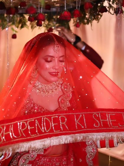 A personalized veil for the bride. The makeup is kept classic and elegant to let special details like this shine.