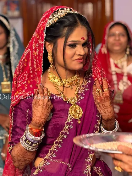 A candid moment during the rituals. The makeup is designed to look beautiful and authentic, respecting all the traditions of the ceremony.