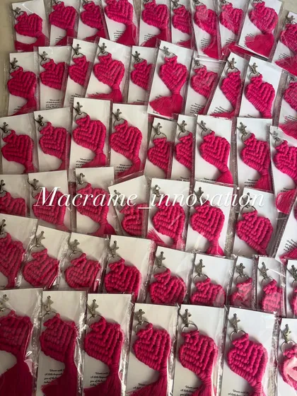 A vibrant batch of bright pink heart keychains, ready to be shipped out.