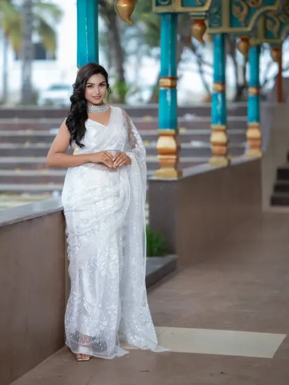 A poised and elegant full-length shot. This look is perfect for a daytime event or a sophisticated evening party.