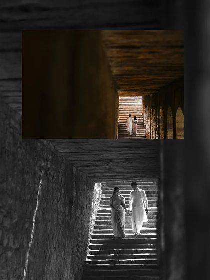 A dramatic shot of the couple ascending a dark, ancient staircase towards the light. This image uses powerful light and shadow to create a sense of journey and hope in their pre wedding story.