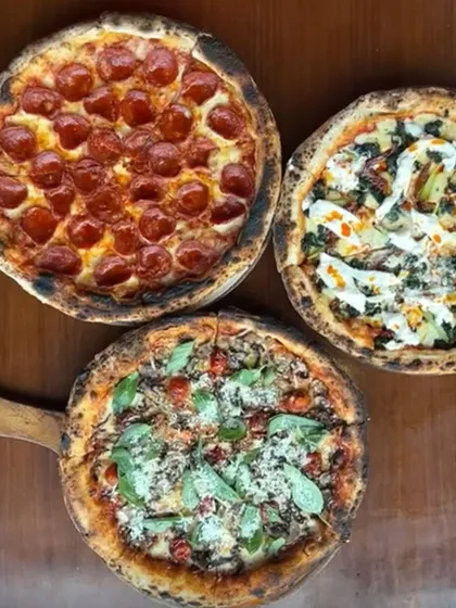 A trio of our wood-fired bestsellers. From classic pepperoni to gourmet vegetarian options, our pizzas are designed to be the centerpiece of your celebration, each with a perfectly charred Neapolitan crust.
