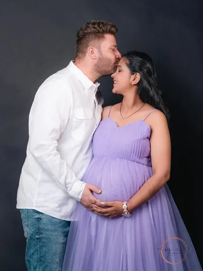 An intimate and loving portrait from a couple's maternity session. The focus here is on the quiet connection and shared happiness, creating a timeless memory before their family grows.