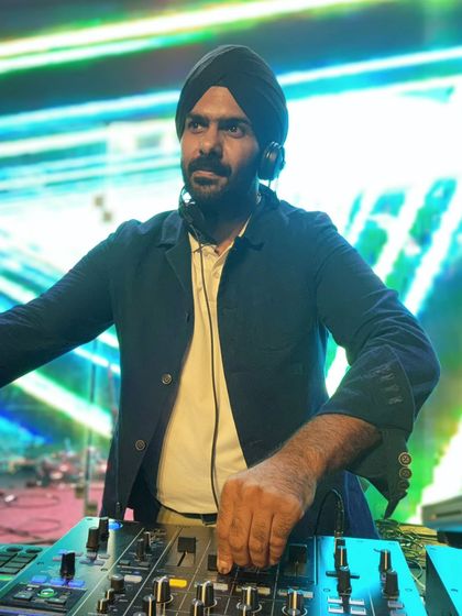 A serious look while concentrating on the mix. It's a balance of fun and intense focus.